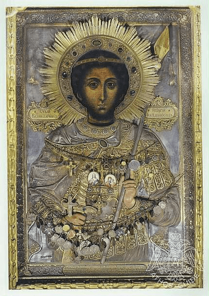 Вы можете найти эту публикацию по следующим поисковым запросом: чудотворная икона святого Георгия Победоносца в проскинитарии северо-западной колонны главного храма Зографа Афон, дар Стефана Великого Молдовлахии иконе Георгия после победы монастырь Зограф, серебряный оклад 1838 года икона Георгия Победоносца с копьём и мечом Зограф, описание иконы Георгия анфас безбородый юноша кудрявые волосы Зограф XVI век, подношения верующих на окладе кресты медальоны икона Георгия Зограф, икона Георгия Победоносца с надписями на старославянском Зограф Афон